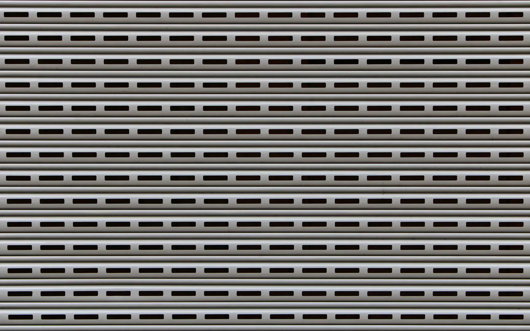 Metal garage door panels with hinge lines